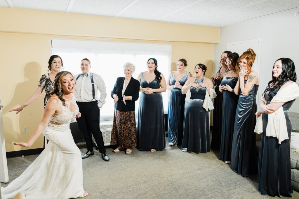 Bride revealing wedding dress to bridesmaids at Windsor Ballroom East Windsor New Jersey