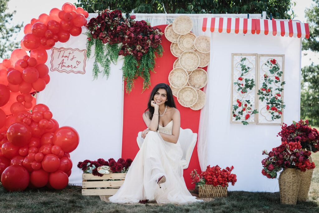 Happy bride posing at outdoor engagement party with Italian backdrop