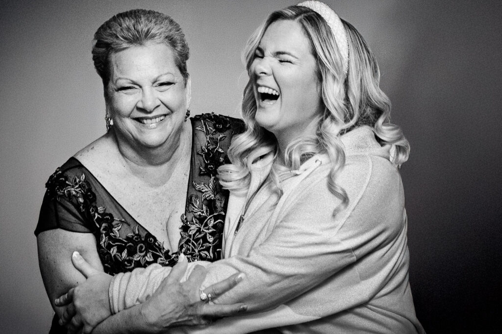 Bride laughing with her mother during wedding getting ready in Bergen County