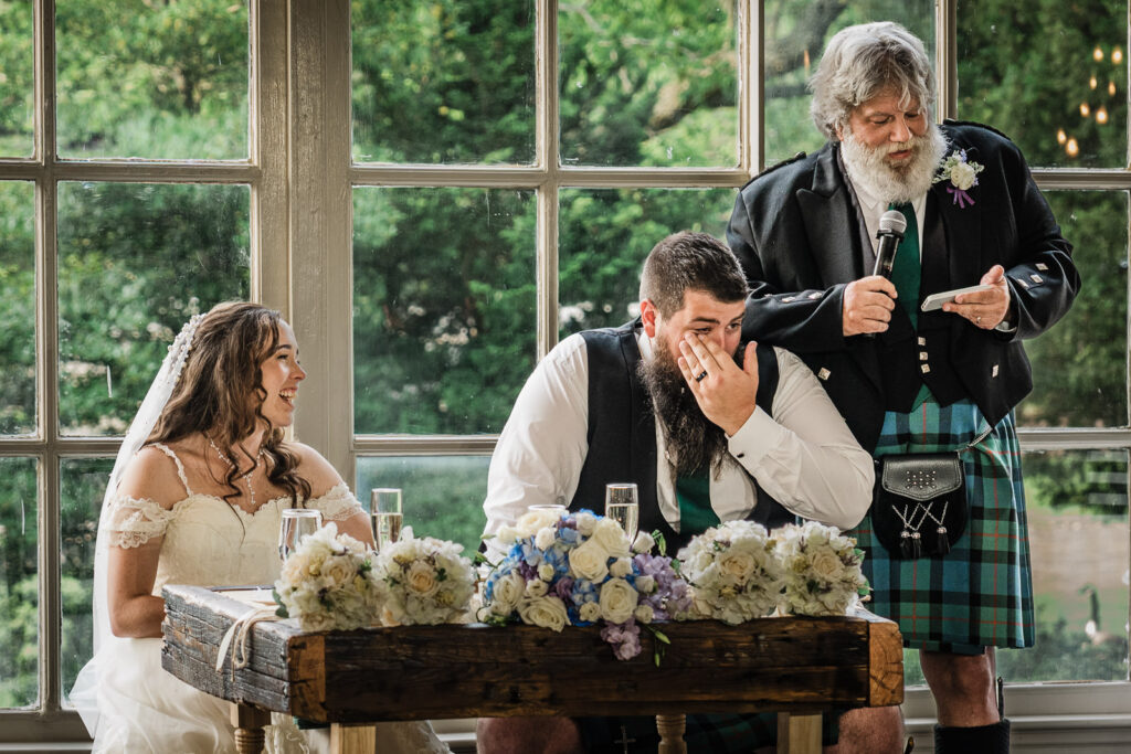 Groom's emotional reaction during wedding toast at northern New Jersey reception