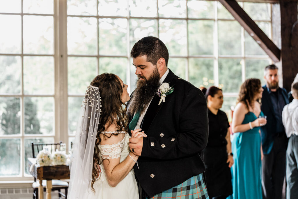 Intimate first dance moment with couple gazing at each other at Smithville Inn reception captured by Alex Kaplan Photography NJ