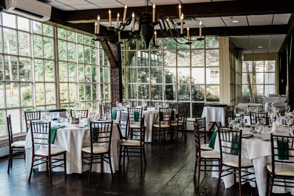 reception-room-interior-large-windows-nj.jpgEmpty reception room interior with large windows, exposed wooden beams and chandeliers at Smithville Inn in Absecon New Jersey