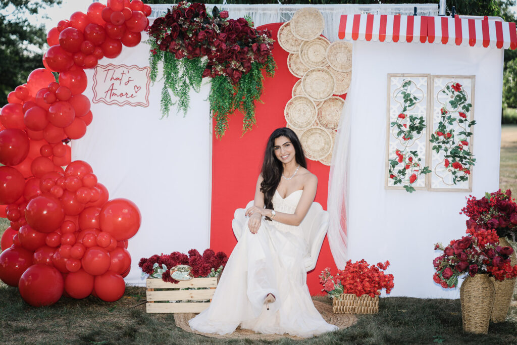 Bride seated in white gown at Italian-themed backyard celebration in Somerset