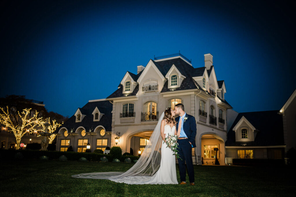Bride and groom at Park Chateau Estate mansion at night East Brunswick NJ wedding
