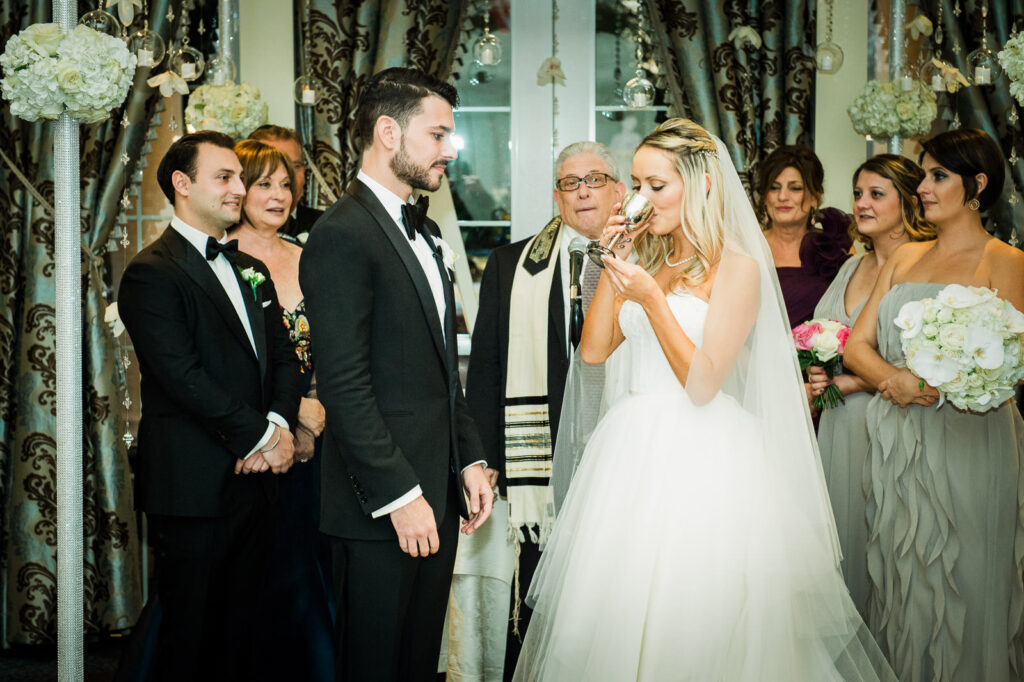 Bride drinking wine ceremony Rockleigh Country Club Jewish wedding