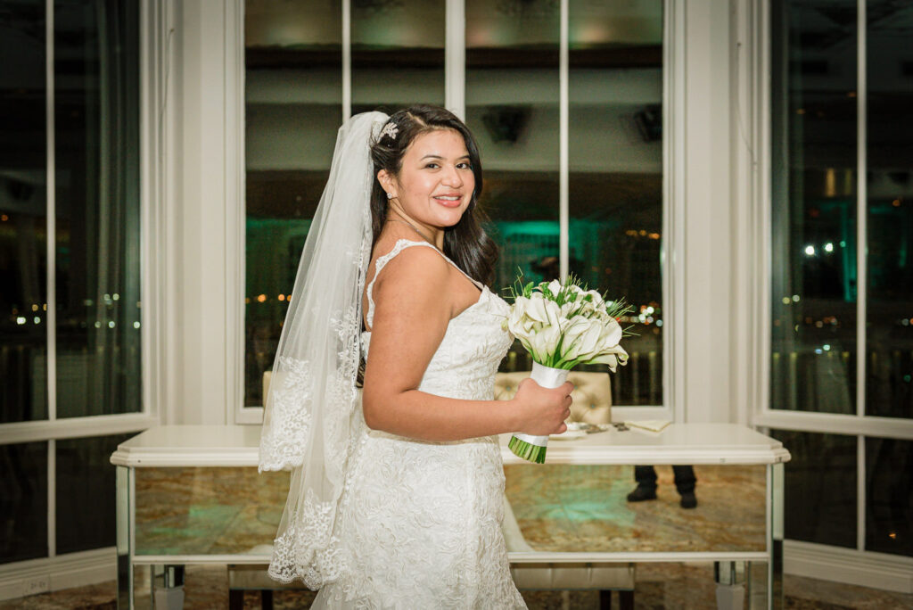 Bride with white lily bouquet at Westmount Country Club by Alex Kaplan