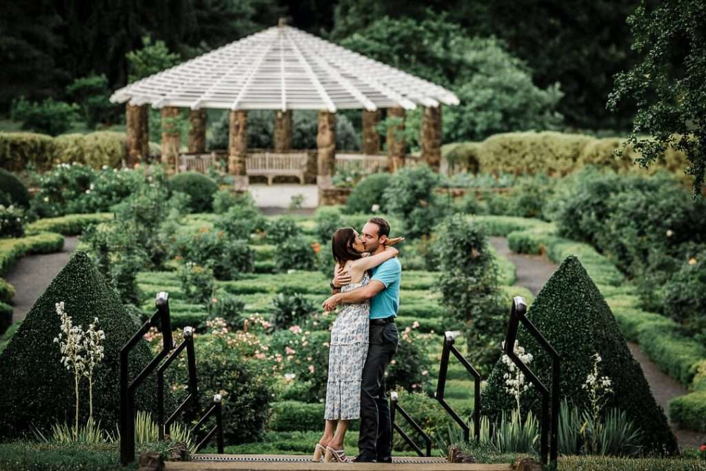 Newly engaged couple embracing after she said yes during surprise proposal at Deep Cut Gardens photographed by Northern NJ proposal photographer Alex Kaplan