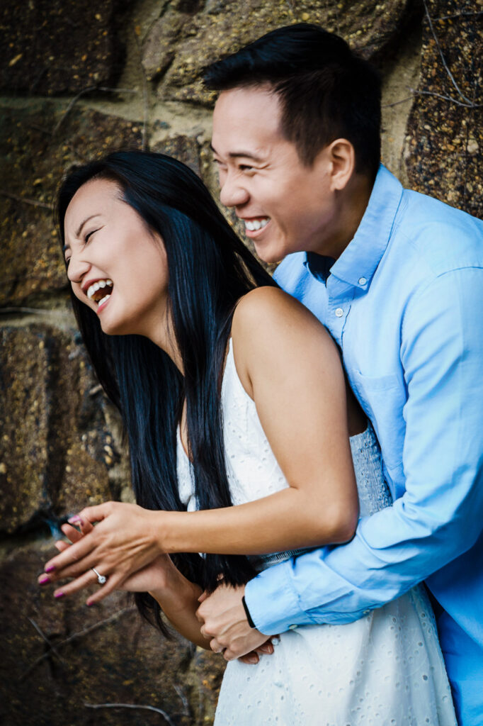 Natural laughter and connection captured during Middletown NJ engagement session at Deep Cut Gardens