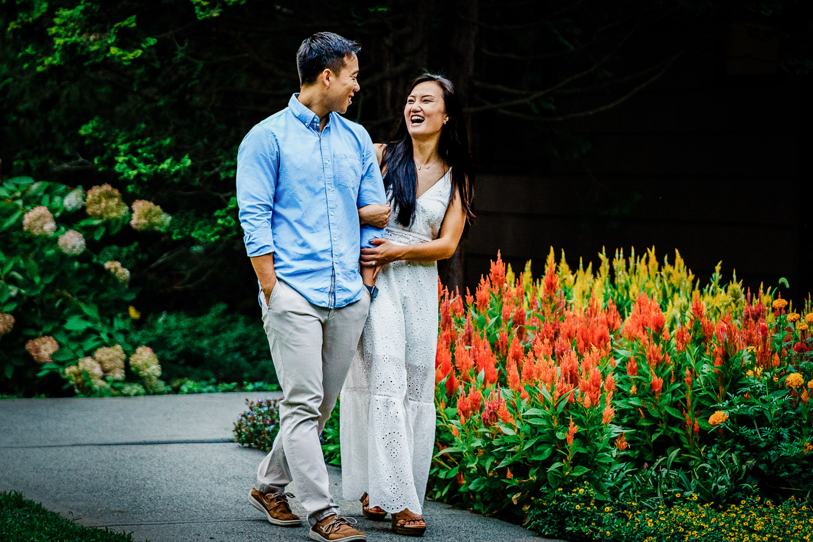 Natural walking pose during Deep Cut Gardens engagement photography session