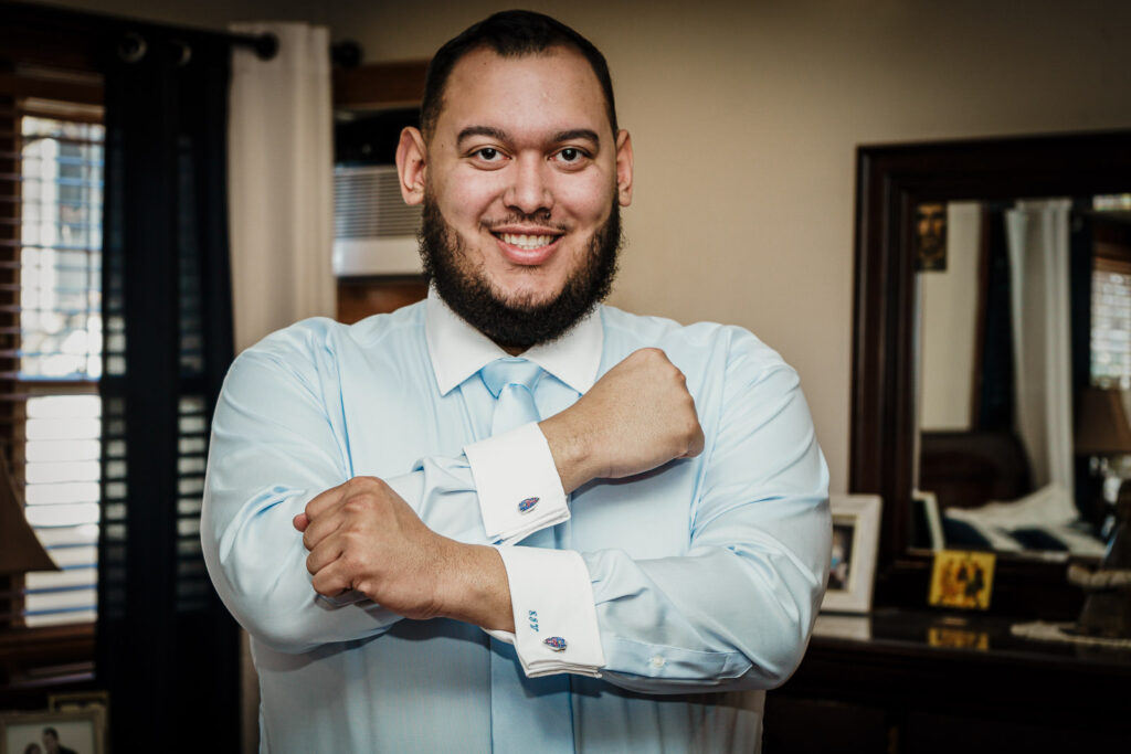 Groom in light blue suit with monogrammed cufflinks by Alex Kaplan
