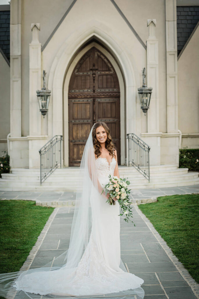 Bridal portrait with cascading bouquet at Park Chateau Gothic chapel East Brunswick