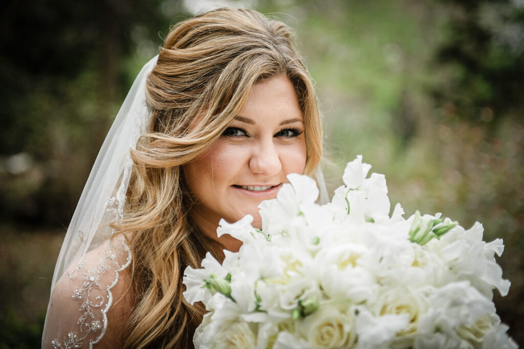 Bride with white rose bouquet at Rockleigh Country Club