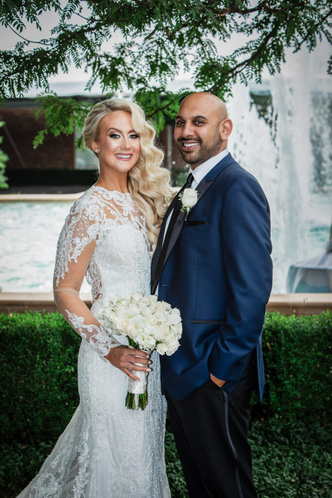 Newlyweds walking down aisle after outdoor ceremony at Rockleigh Country Club