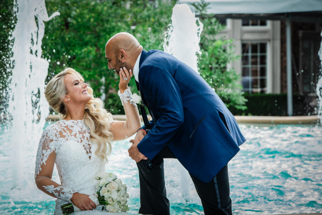 Bride and groom portrait by fountain at Rockleigh Country Club New Jersey