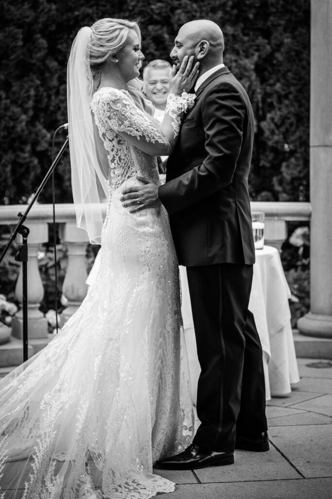 Outdoor ceremony under columned pergola at Rockleigh Country Club in black and white