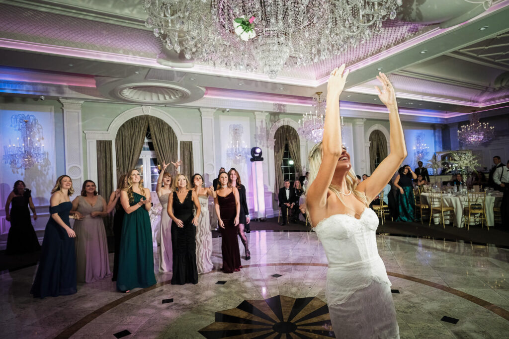 Bouquet toss Rockleigh Country Club ballroom reception