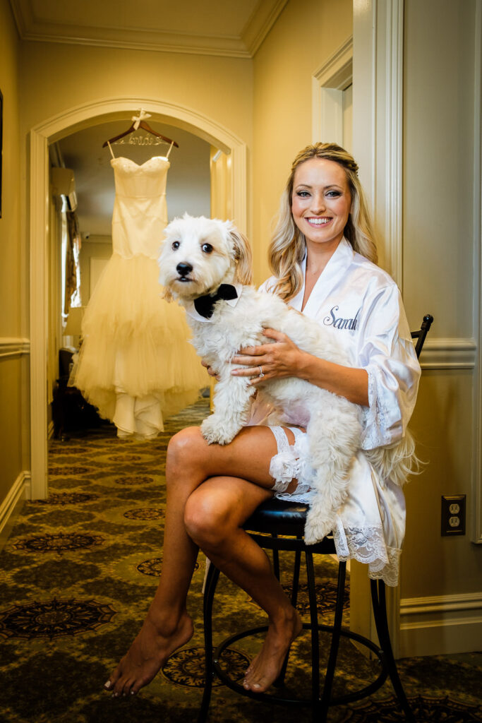 Bride with dog and wedding dress Rockleigh Country Club getting ready