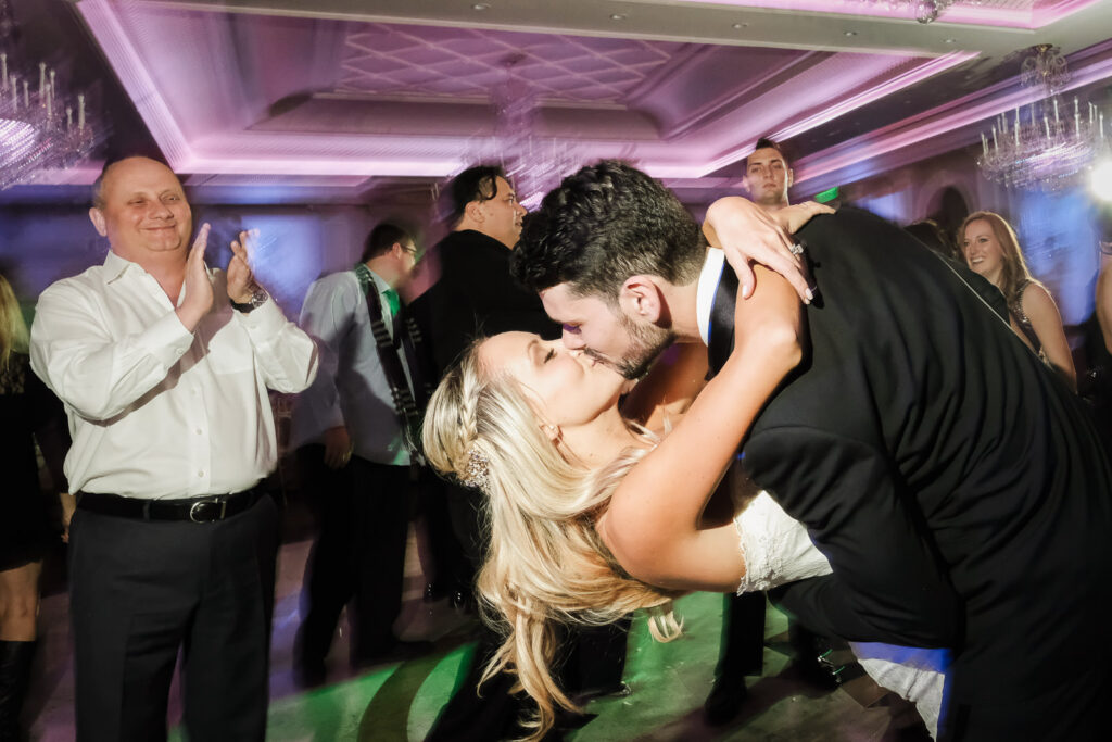 Dance floor kiss Rockleigh Country Club wedding reception