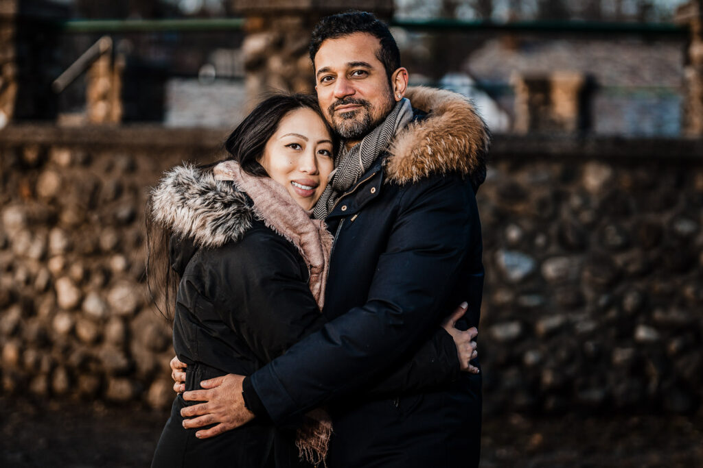 Winter engagement session Verona Park couple embracing stone walls NJ by Alex Kaplan