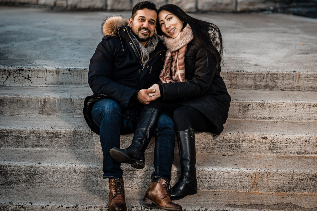 Verona Park engagement couple sitting stone steps winter NJ