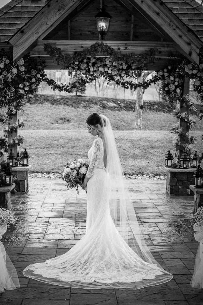 Bride with cathedral length veil at Hamilton Farm Golf Club ceremony space