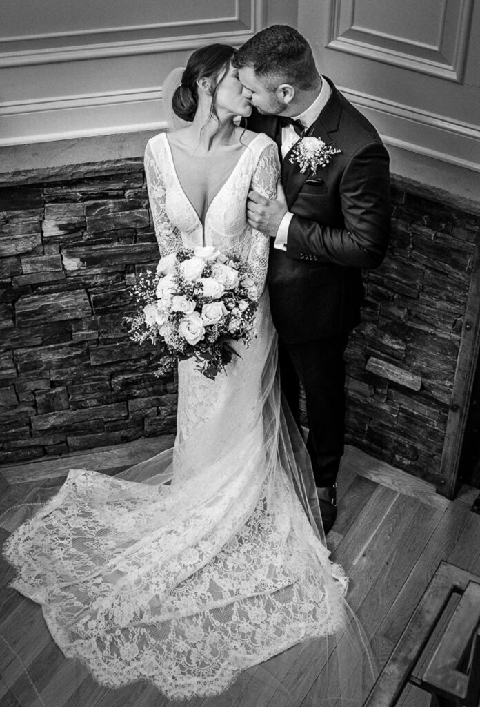 Newlyweds kissing at Hamilton Farm Golf Club wedding