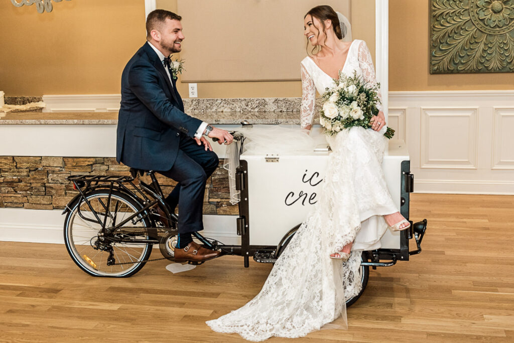 Bride and groom on vintage ice cream bike at Hamilton Farm Golf Club in Gladstone NJ