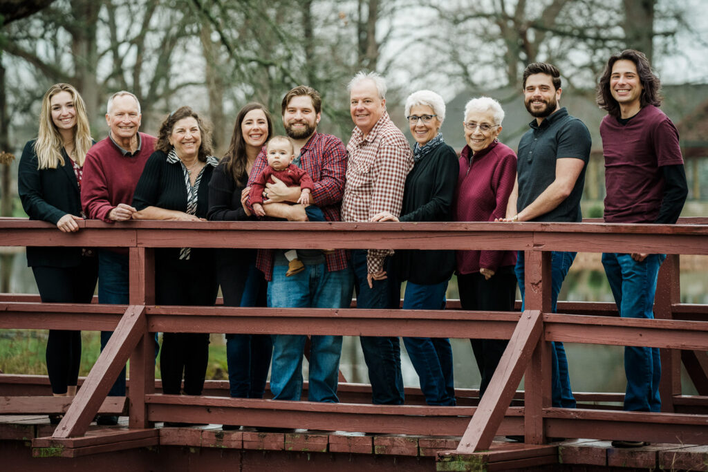 Extended family portrait on wooden bridge at Knight Park in Collingswood