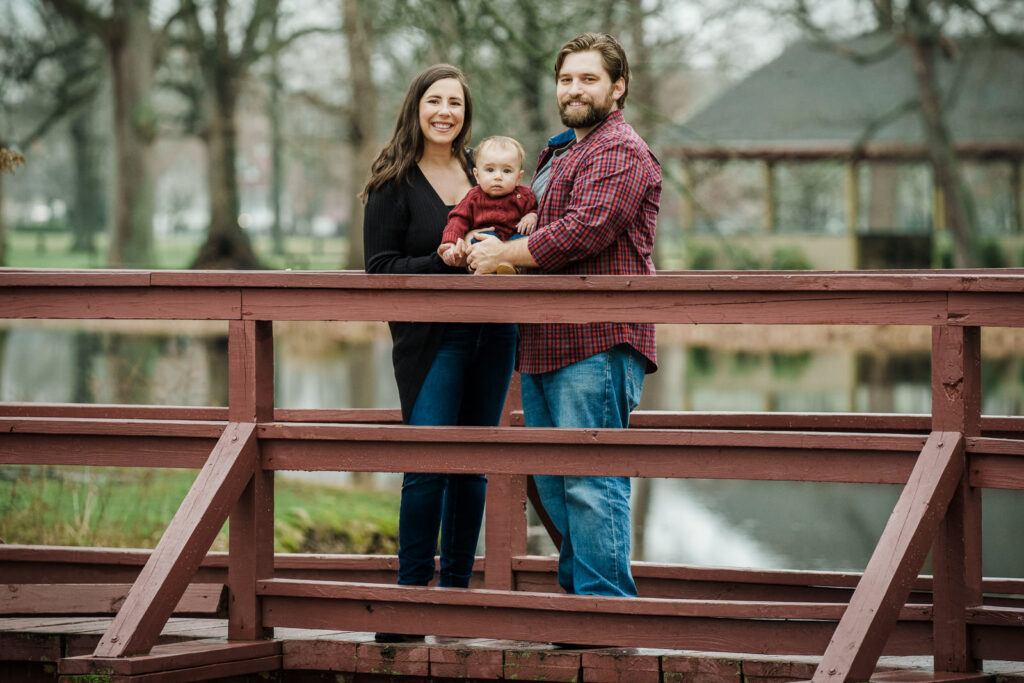 Young family of three on bridge at Knight Park in Collingswood NJ