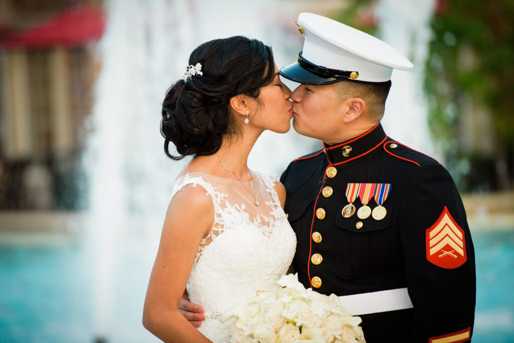 Close-up portrait of couple by fountain at Rockleigh Country Club