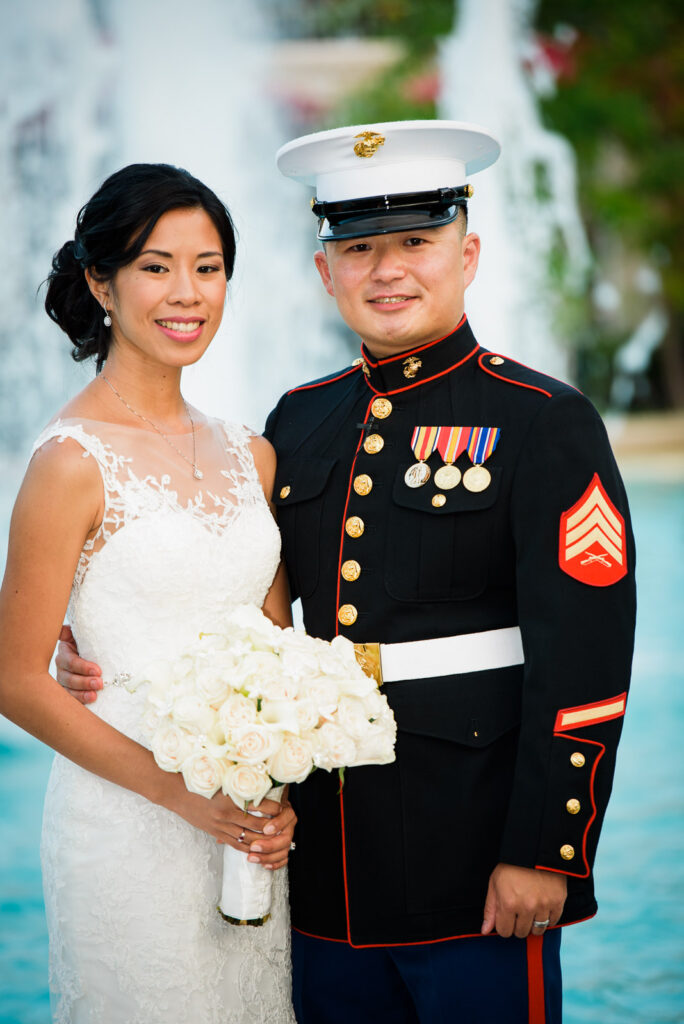 Marine groom and bride portrait by fountain at Rockleigh Country Club