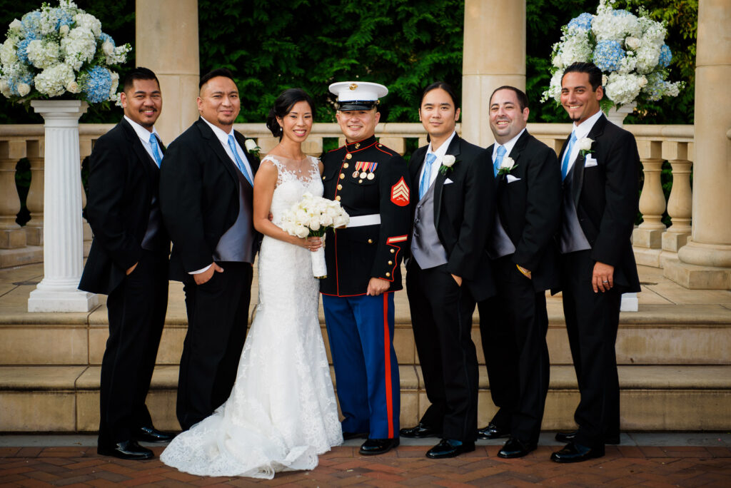 Bride and Marine groom with groomsmen at Rockleigh Country Club pavilion