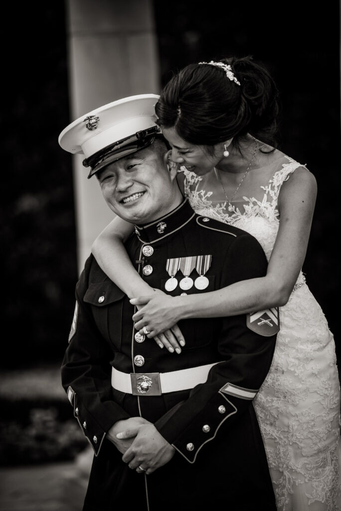 Couple kissing under rotunda columns at Rockleigh Country Club
