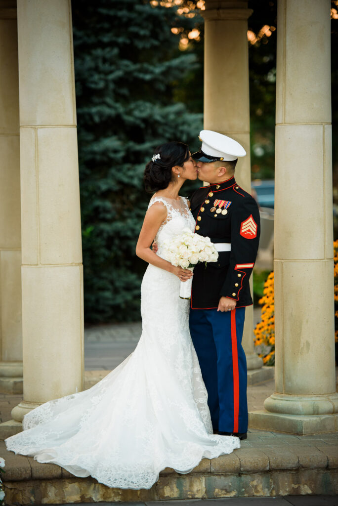 Bride and Marine groom under copper-domed rotunda at Rockleigh Country Club
