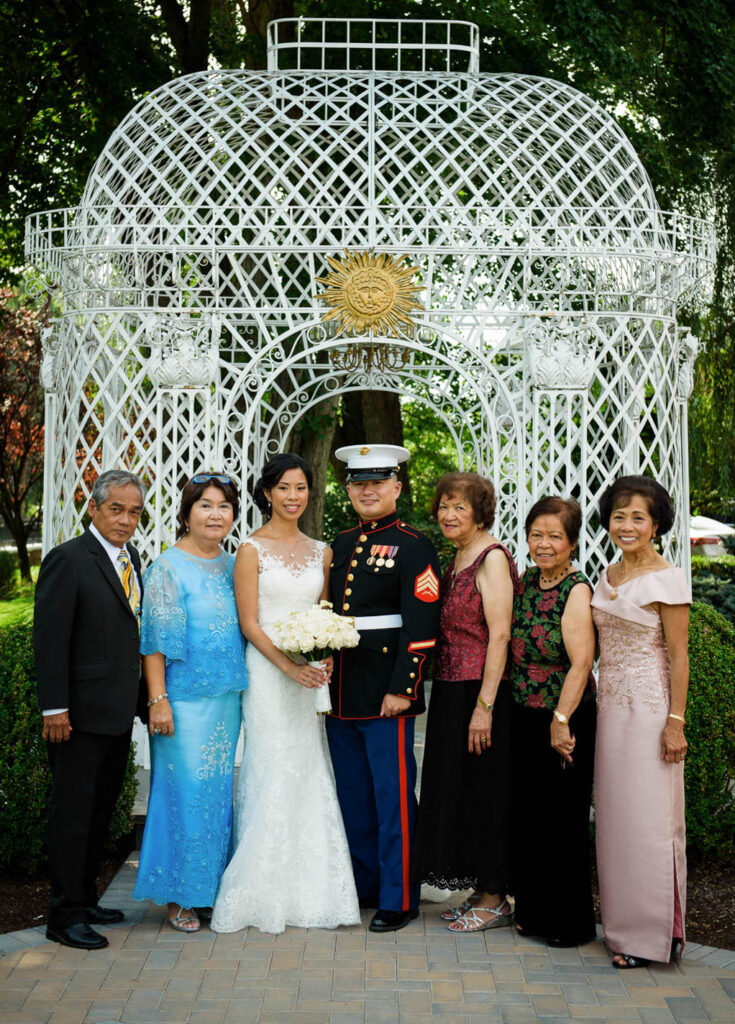 Wedding family portrait under ornate white gazebo at Rockleigh Country Club