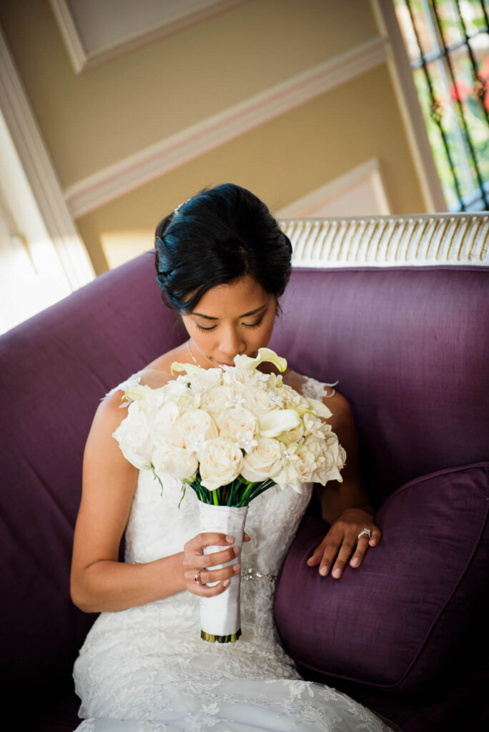 Groomsmen taking photos of bride at Rockleigh Country Club pavilion