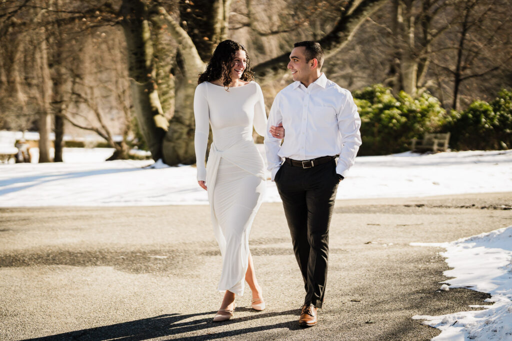 Couple walking along a winter garden path at Skylands Botanical Garden, Ringwood NJ