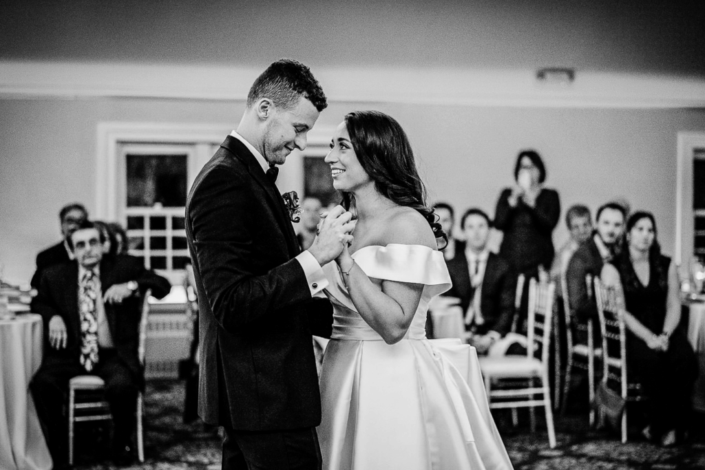 First dance in Skylands Manor ballroom with crystal chandeliers
