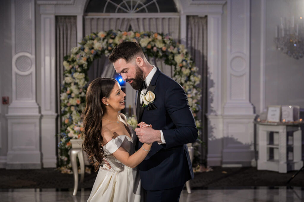 Bride and groom intimate dance moment at winter wedding reception