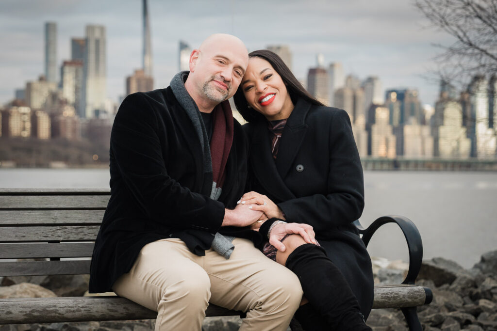 Final engagement portrait at Waterside Restaurant North Bergen with Hudson River and NYC skyline backdrop