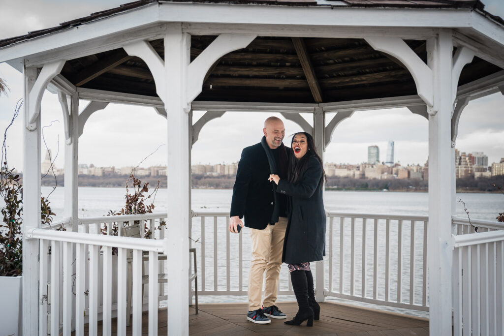 Engagement portraits at Waterside Restaurant North Bergen NJ waterfront gazebo with NYC views