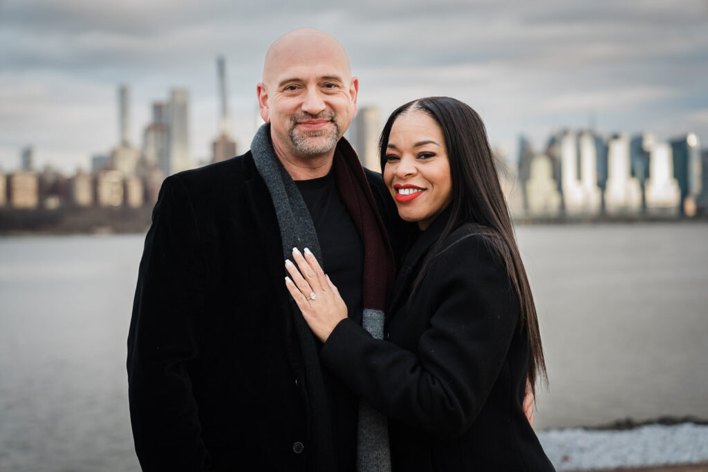 Close-up of engagement ring with Hudson River and NYC skyline at Waterside Restaurant North Bergen NJ