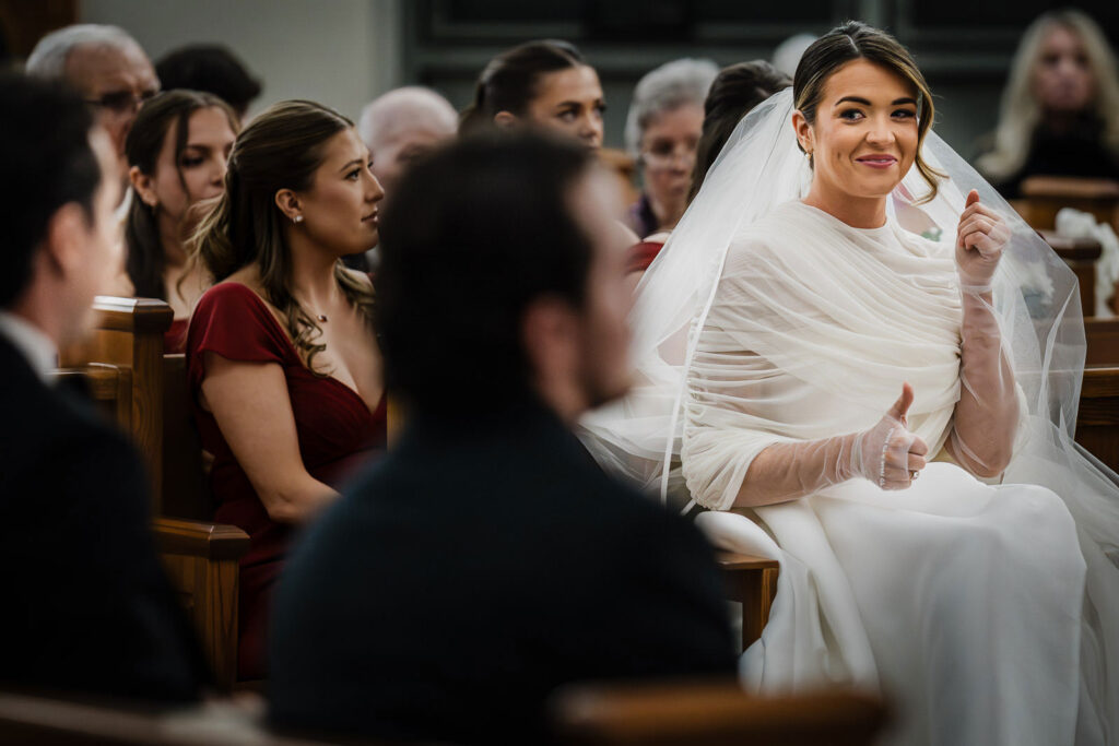 Bride smiling with emotion during her Catholic wedding ceremony at St. Catharine Church in Glen Rock NJ