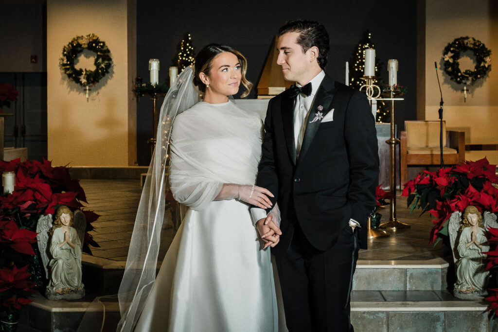 Couple at church altar during wedding ceremony at St. Catharine Church in Glen Rock NJ