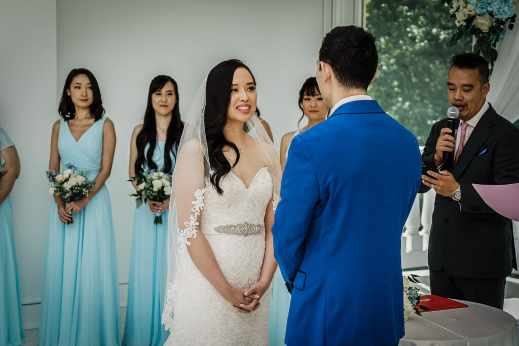 Bride smiling during her wedding ceremony at Crystal Plaza in Livingston NJ