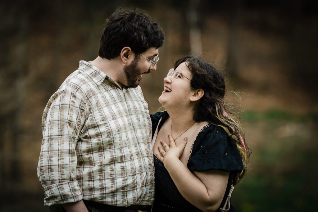 Candid close-up portrait of woman laughing up at partner at Reeves-Reed Arboretum New Jersey