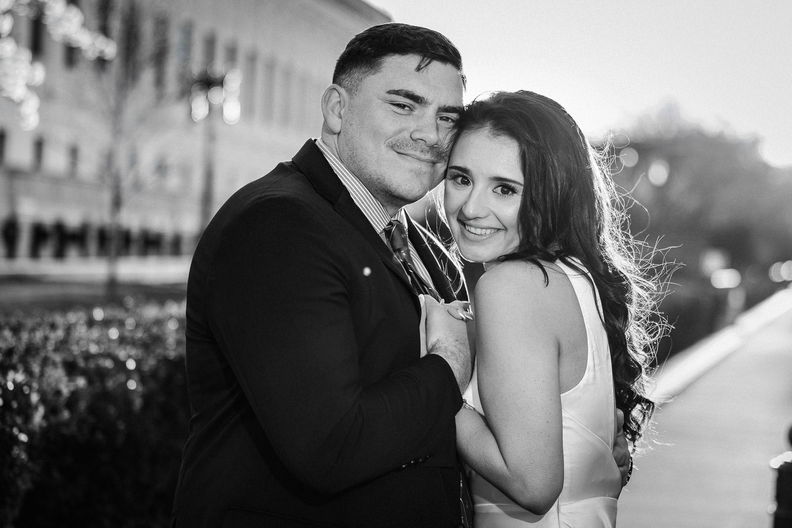 Couple celebrating surprise proposal at romantic restaurant table in New Jersey with candles and champagne
