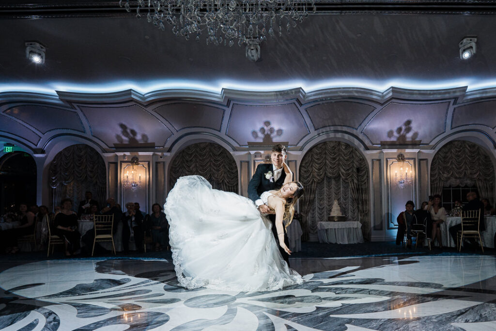 Couple sharing a romantic first dance dip at The Meadow Wood, a luxury NJ wedding venue, captured by Alex Kaplan