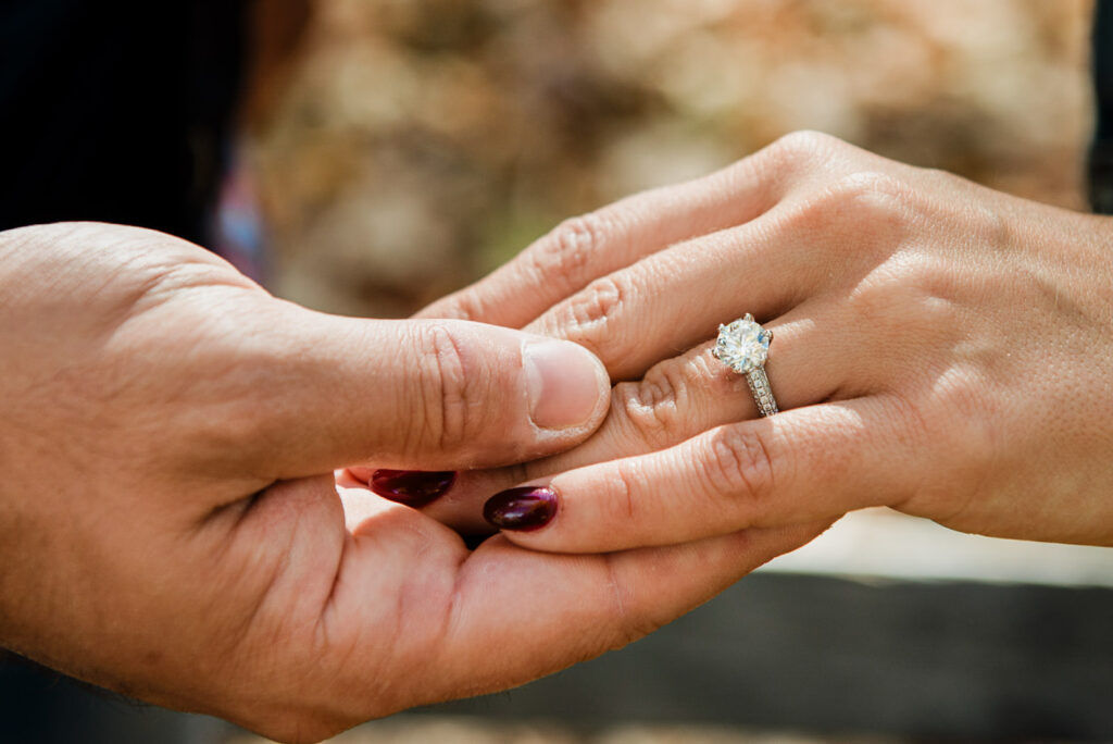 Close-up engagement ring detail photo taken during a fall engagement session in New Jersey outdoors