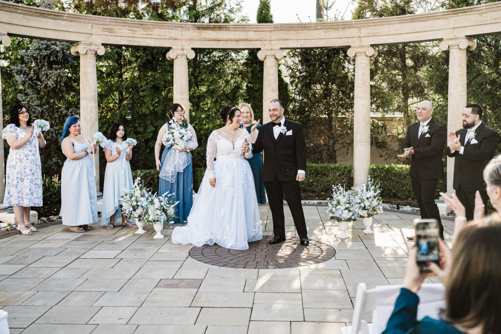 Bridal party applauding bride and groom at Macaluso's wedding ceremony Hawthorne NJ